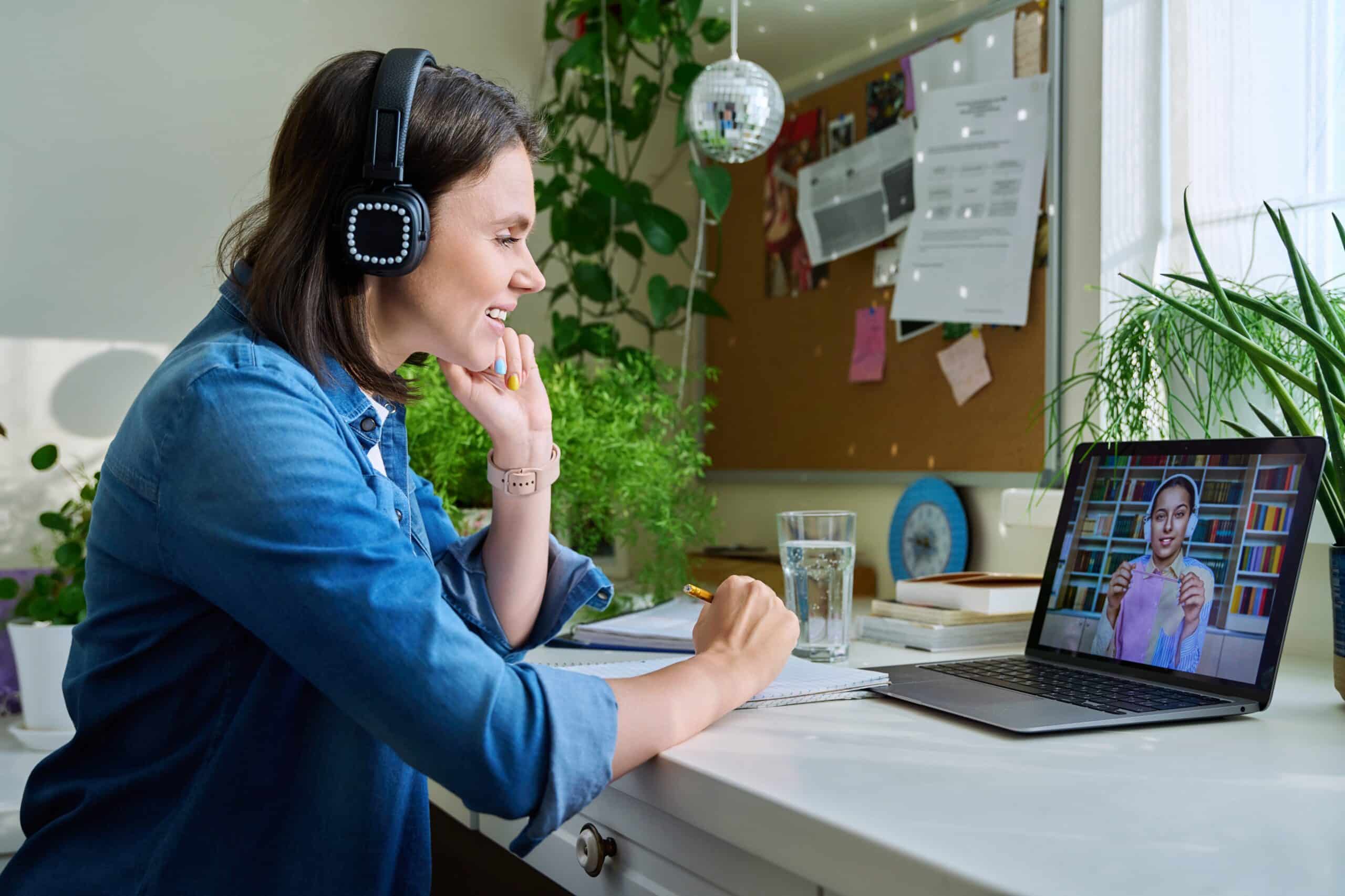 female teacher with headphones teaching young student english online female teacher with headphones teaching young student english online