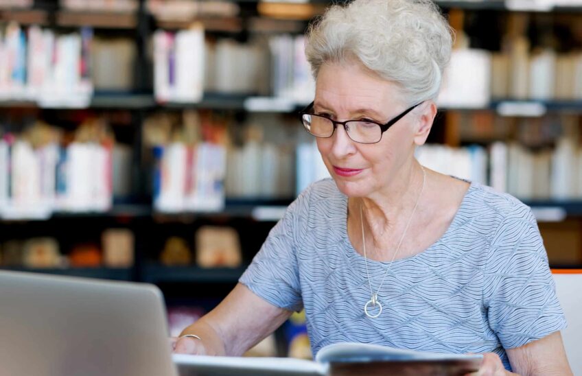 mature aged woman teaching and learning online